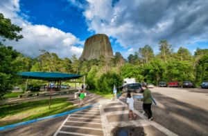 Family in parking lot at Devils Tower